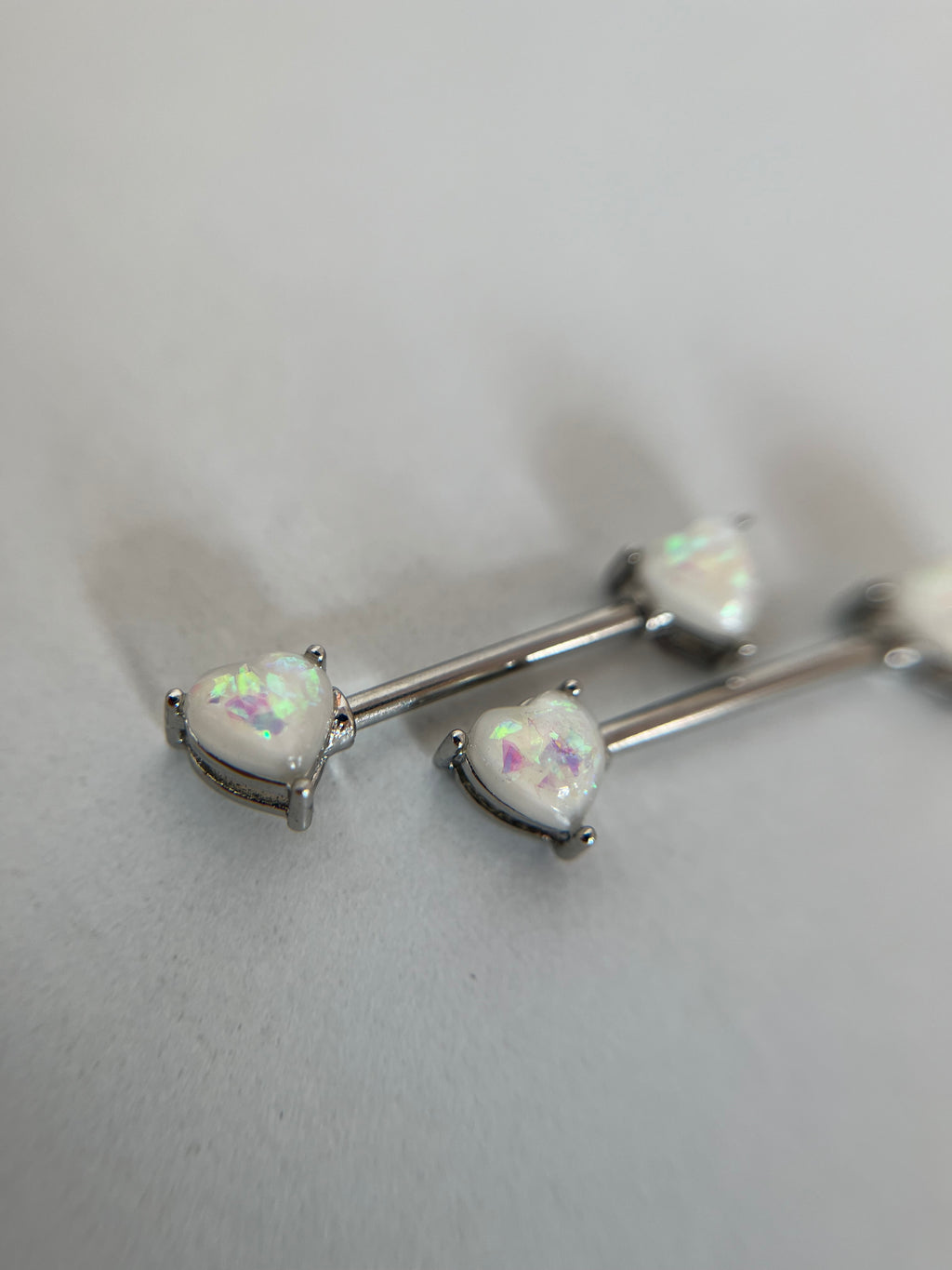 Piercing pezones corazón tornasol