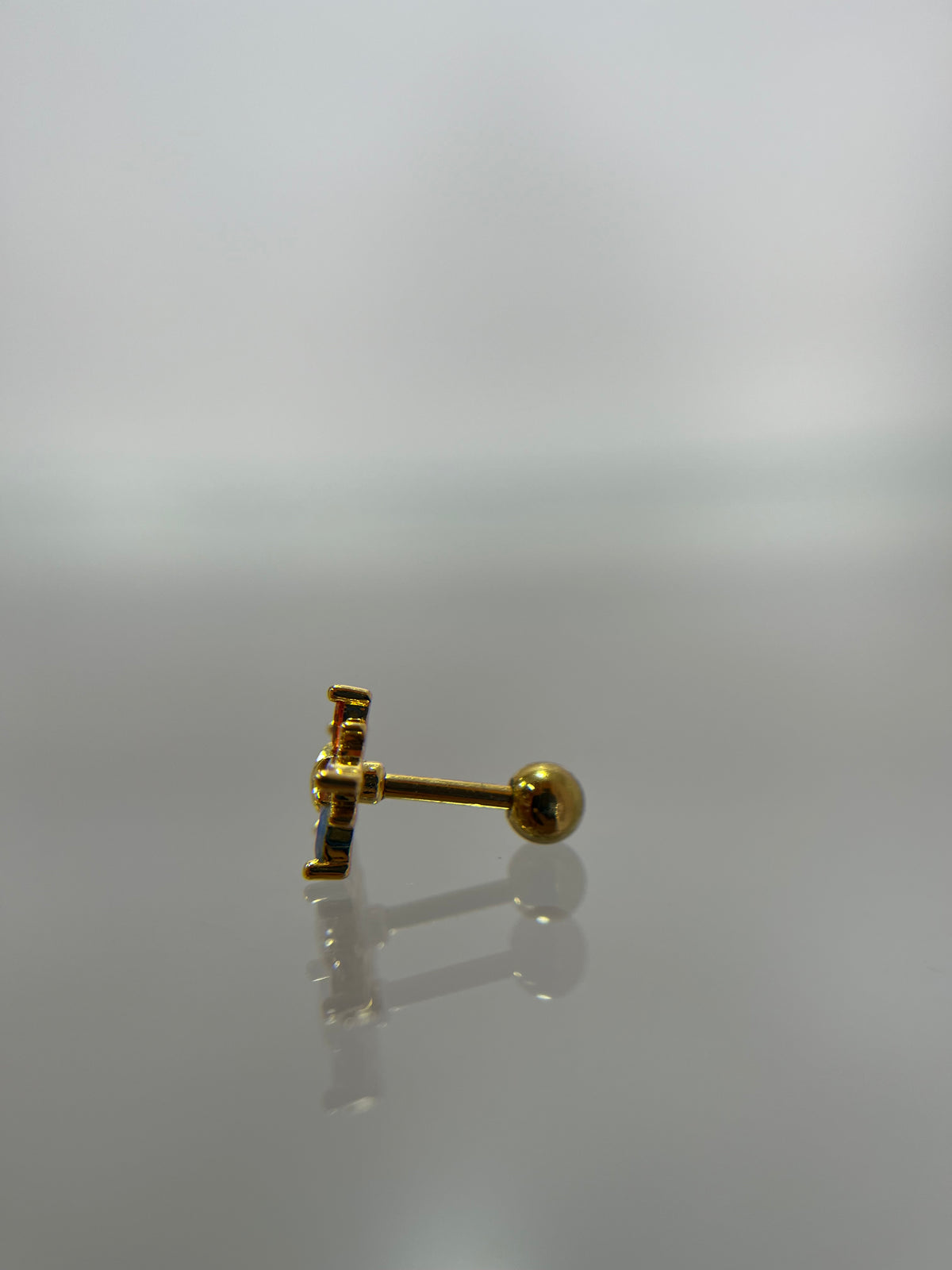Piercing estrella titanium dorado (cierre bolilla)