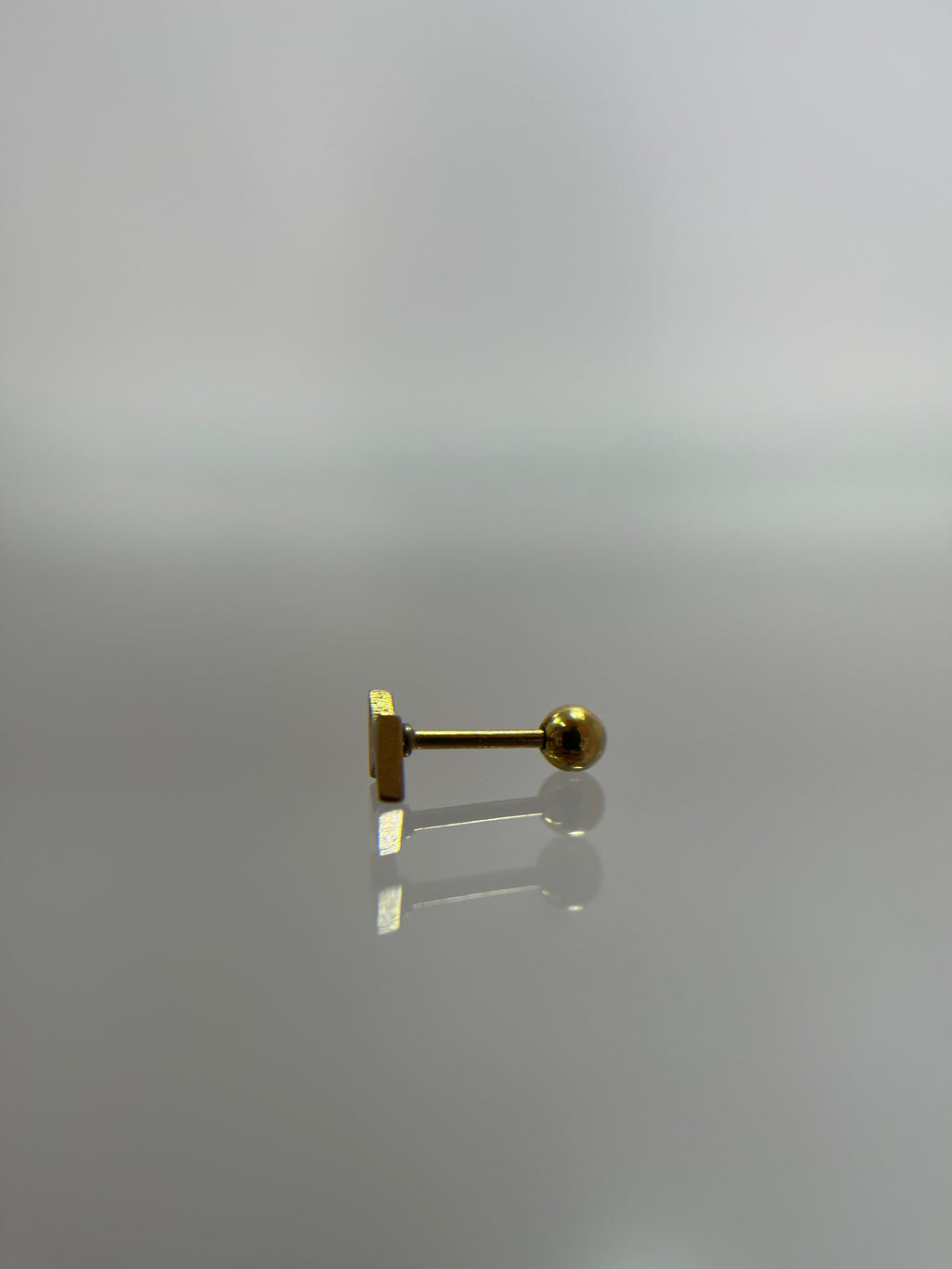 Piercing rayo titanium dorado (cierre bolilla)