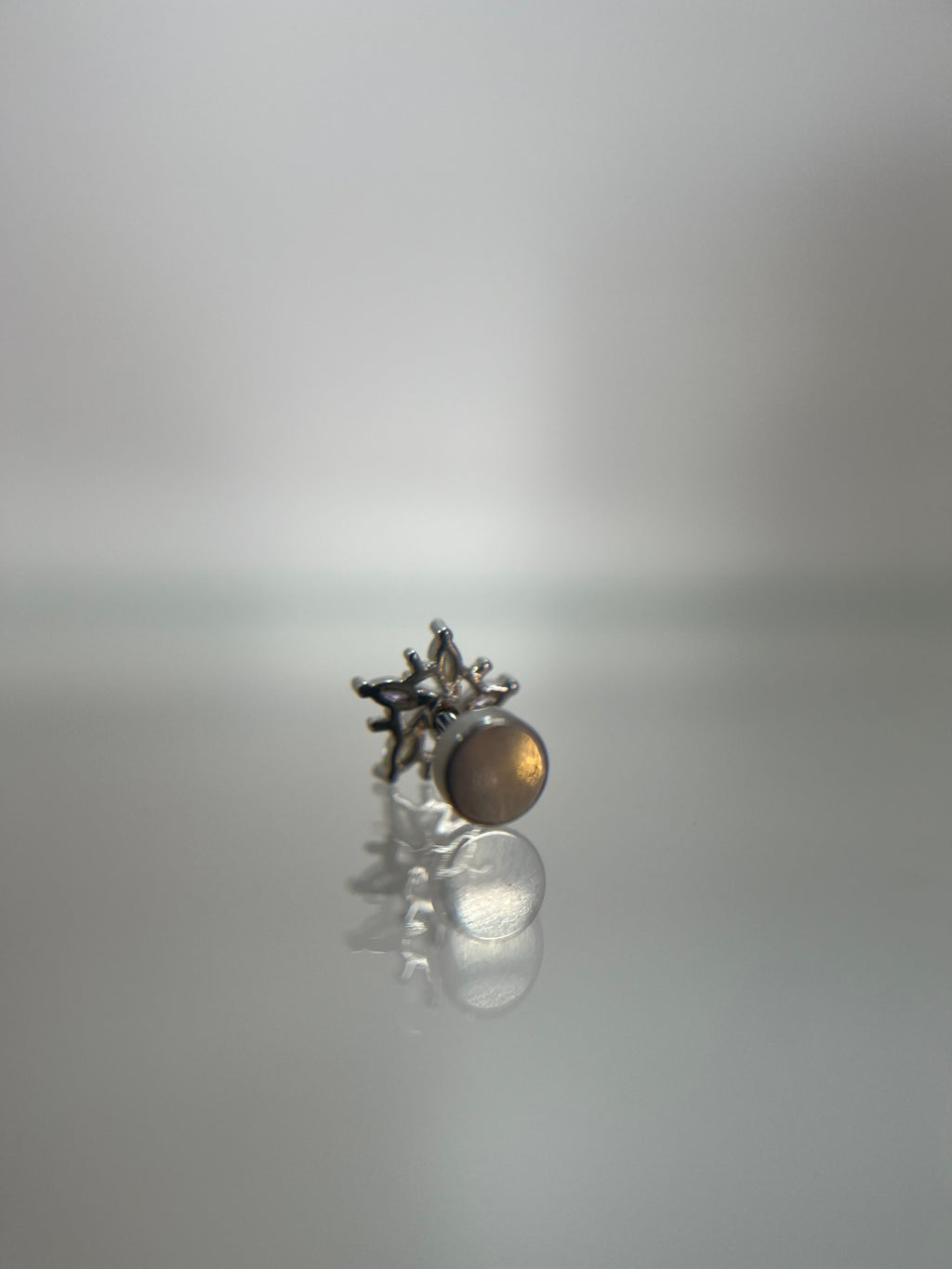 Piercing estrella invertida acero plateado (cierre plano)