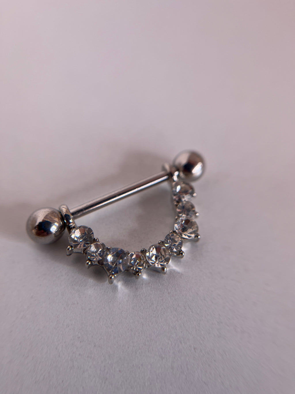 Piercings pezones diamantes
