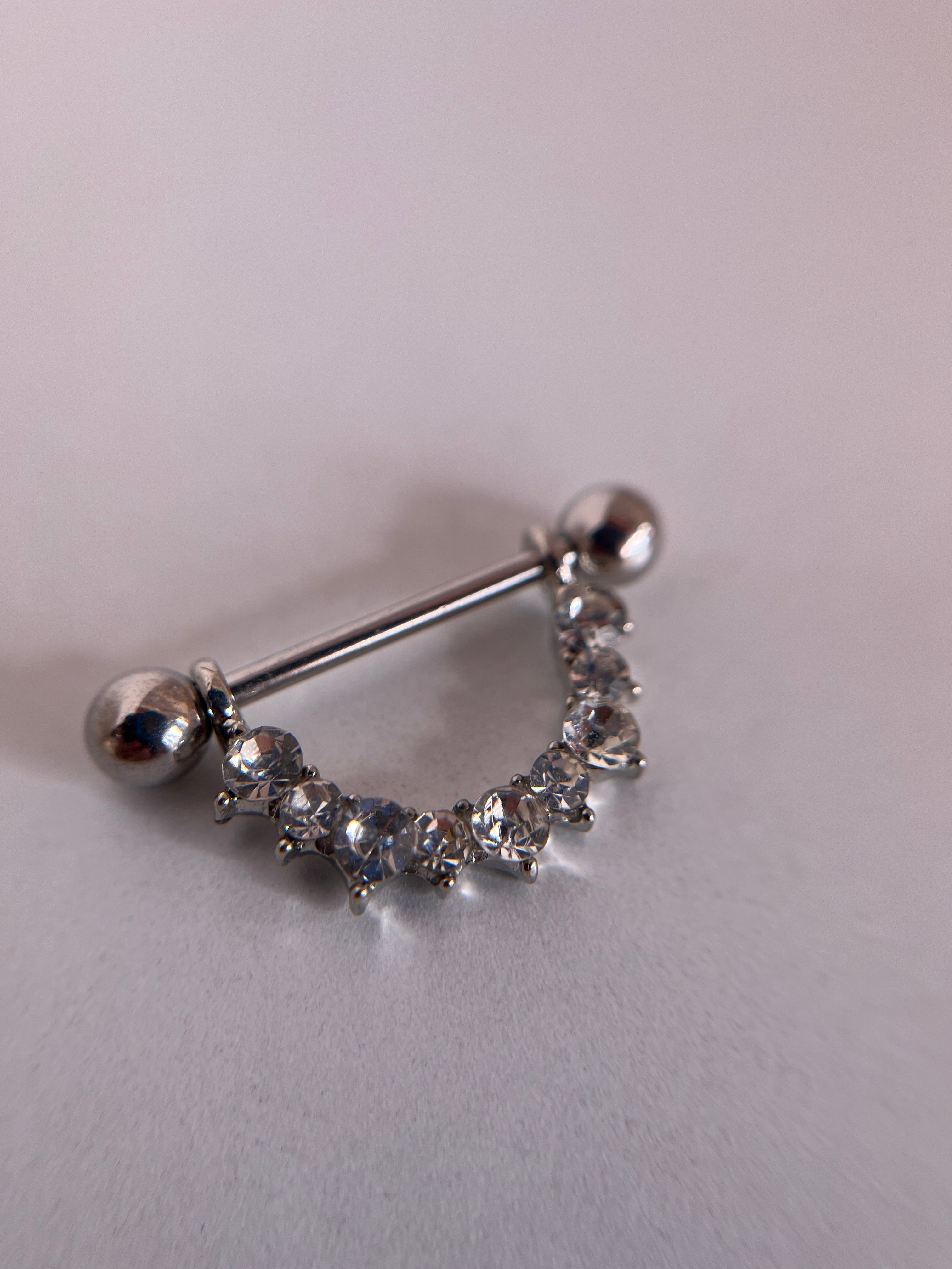 Piercings pezones diamantes