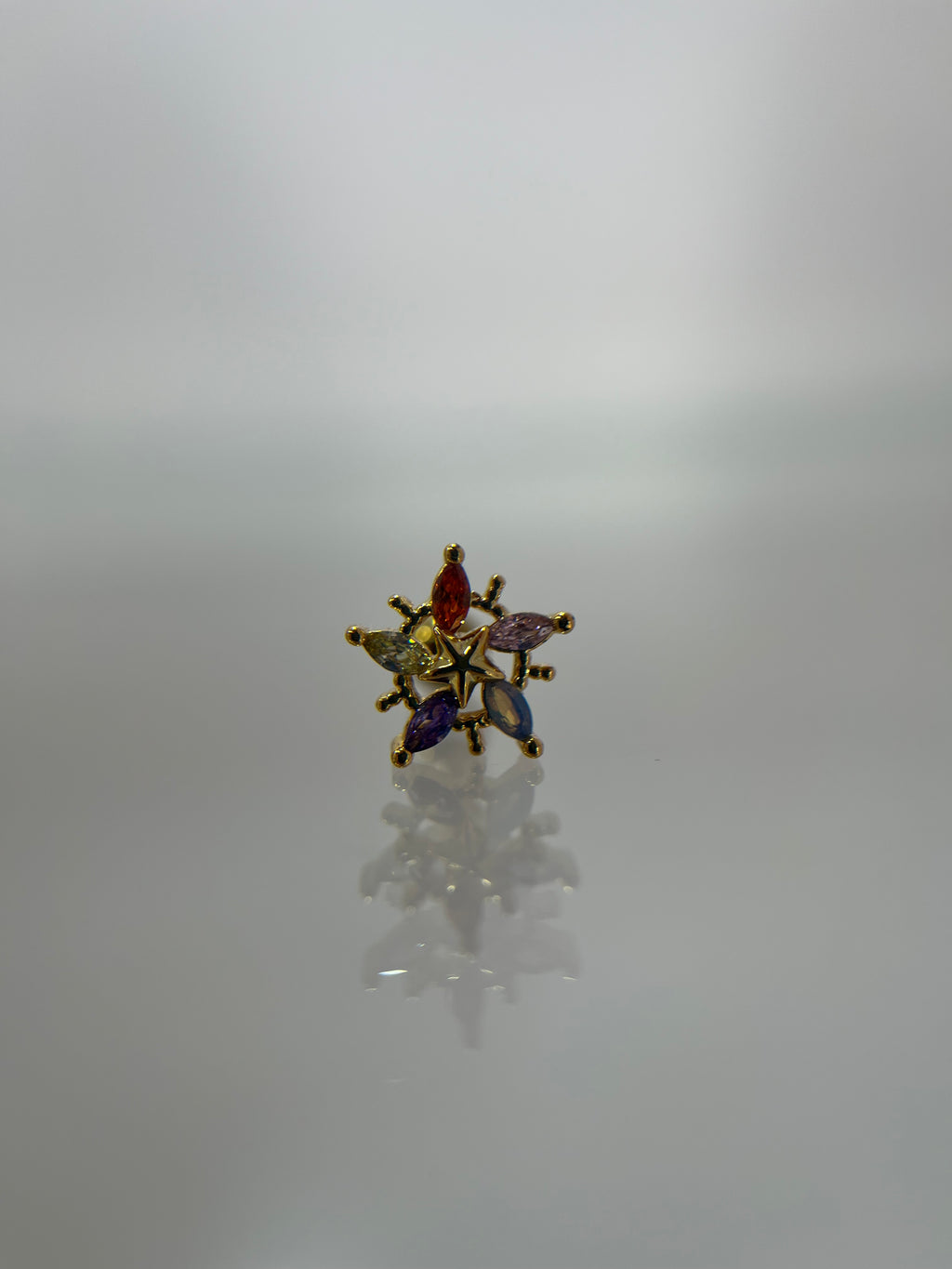 Piercing estrella titanium dorado (cierre bolilla)