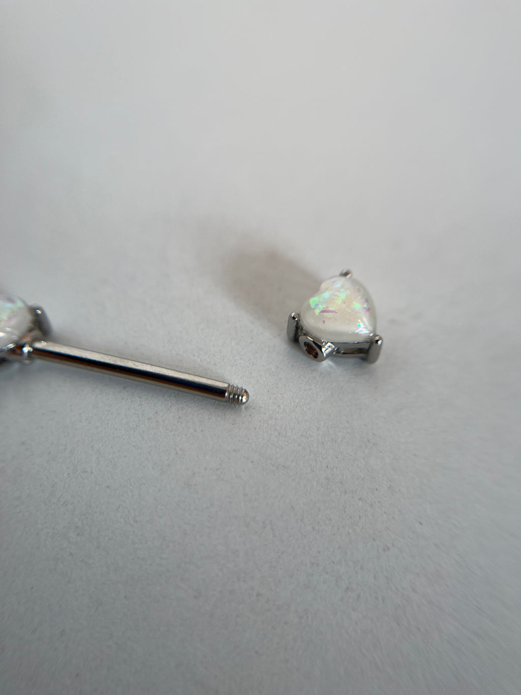 Piercing pezones corazón tornasol
