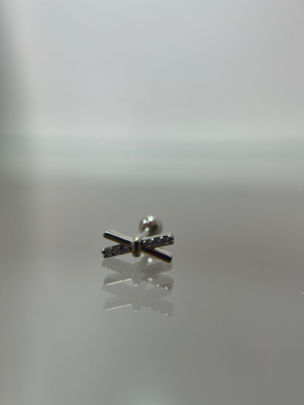 Piercings barras cruzadas (cierre esfera)