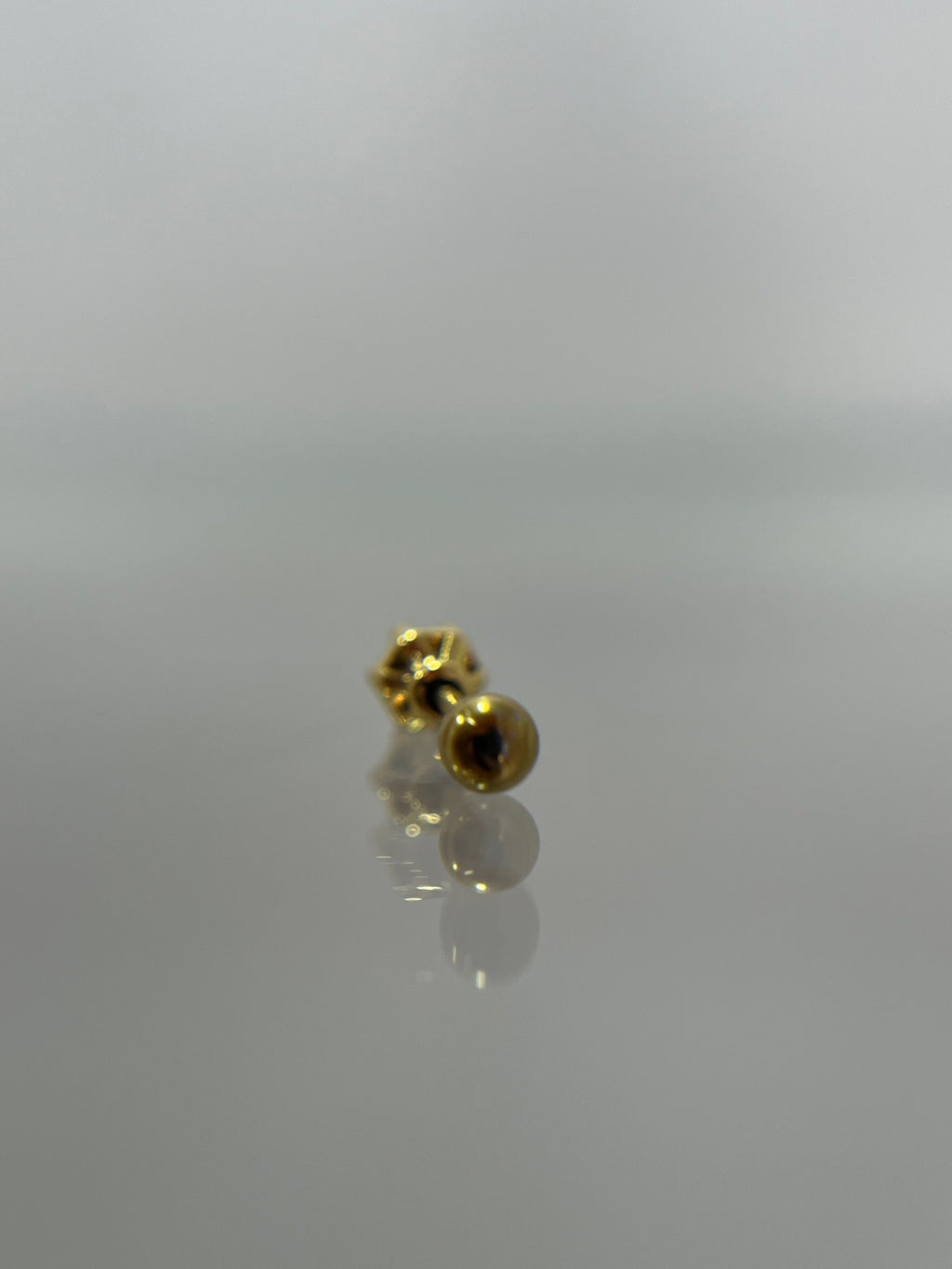 Piercing gema dorado titanium  (cierre bolilla)