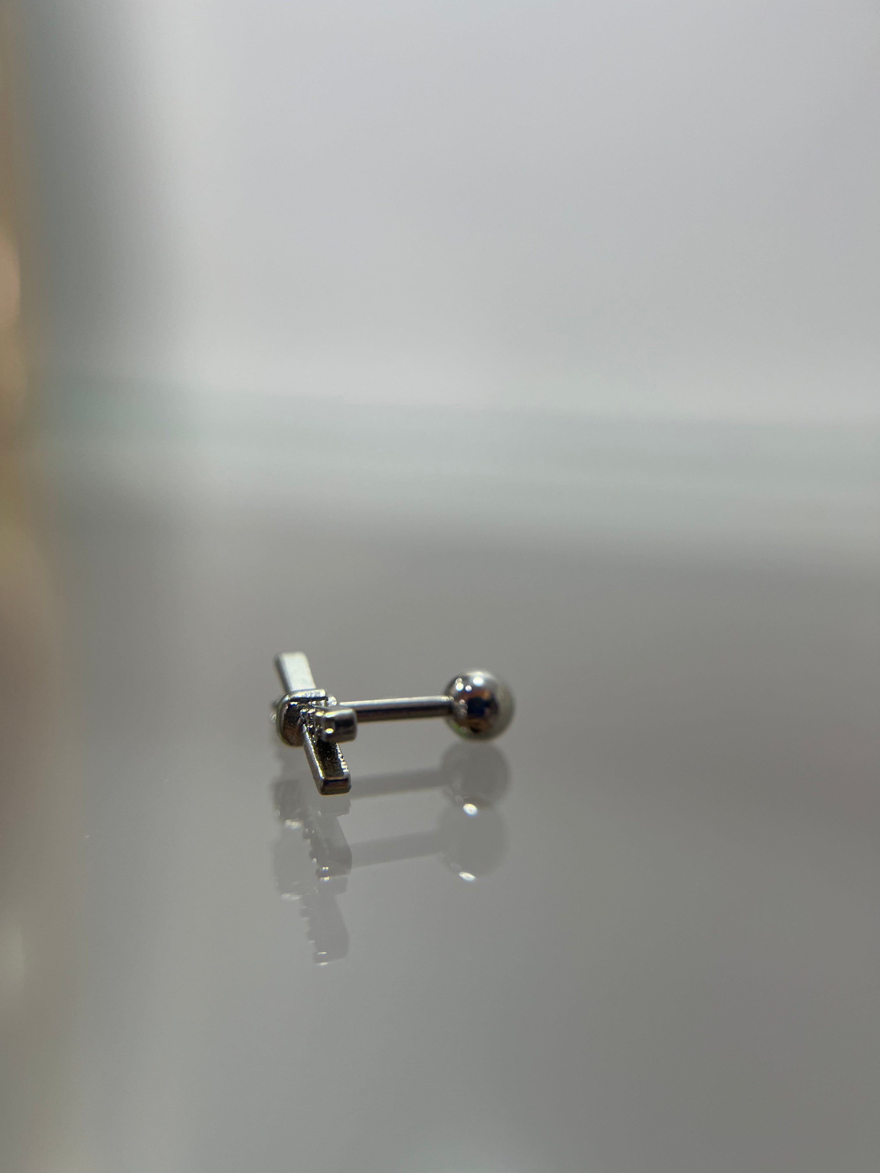 Piercings barras cruzadas (cierre esfera)