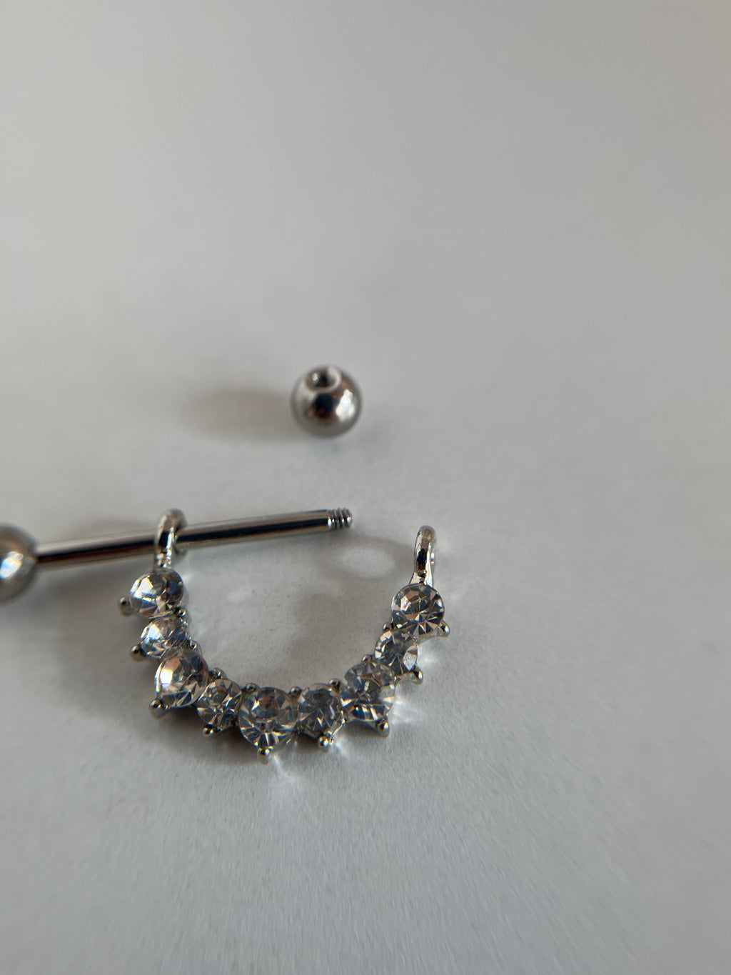 Piercings pezones diamantes