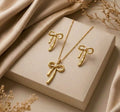 Set collar + aretes moño dorado