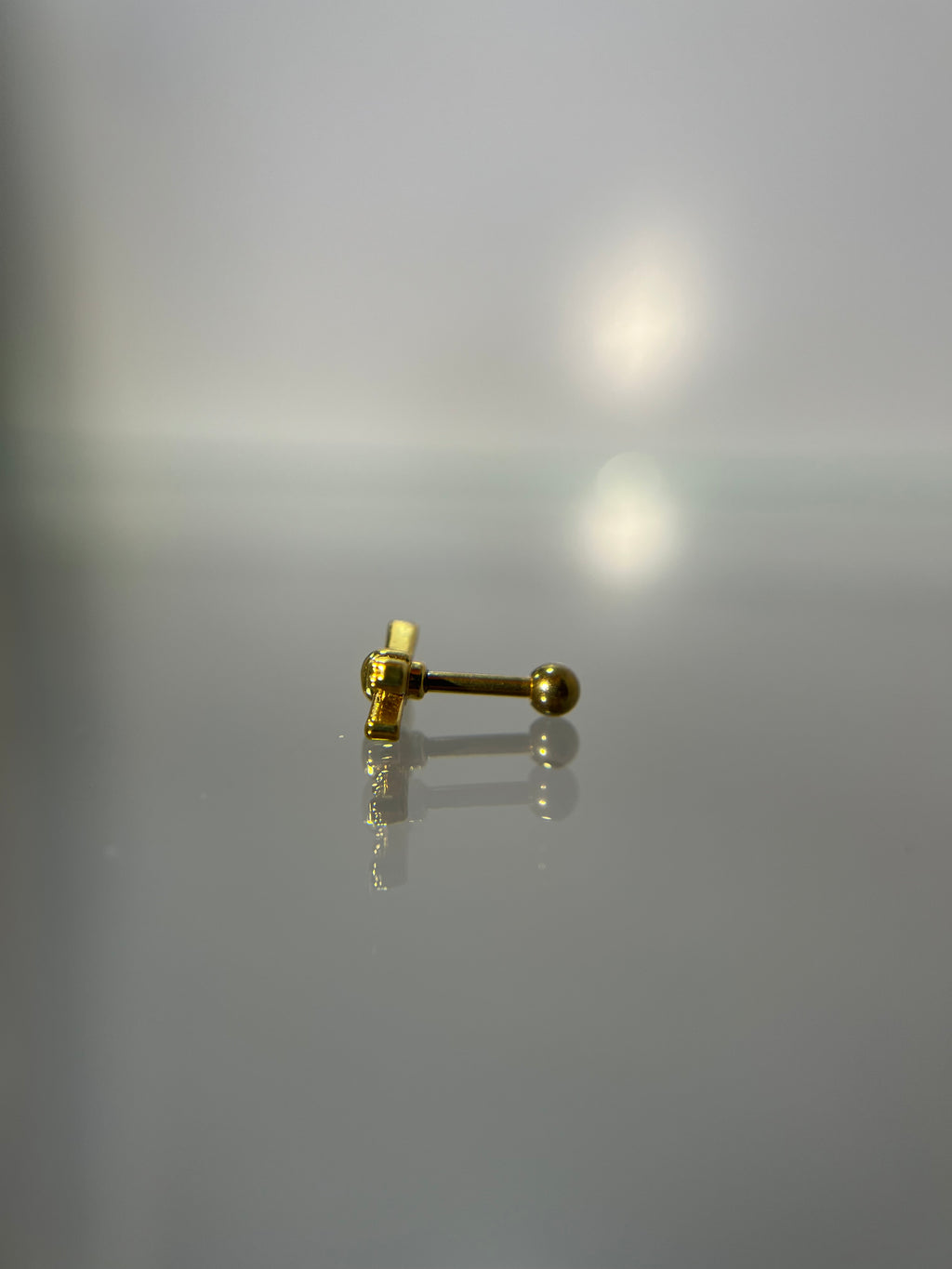Piercings barras cruzadas (cierre esfera)