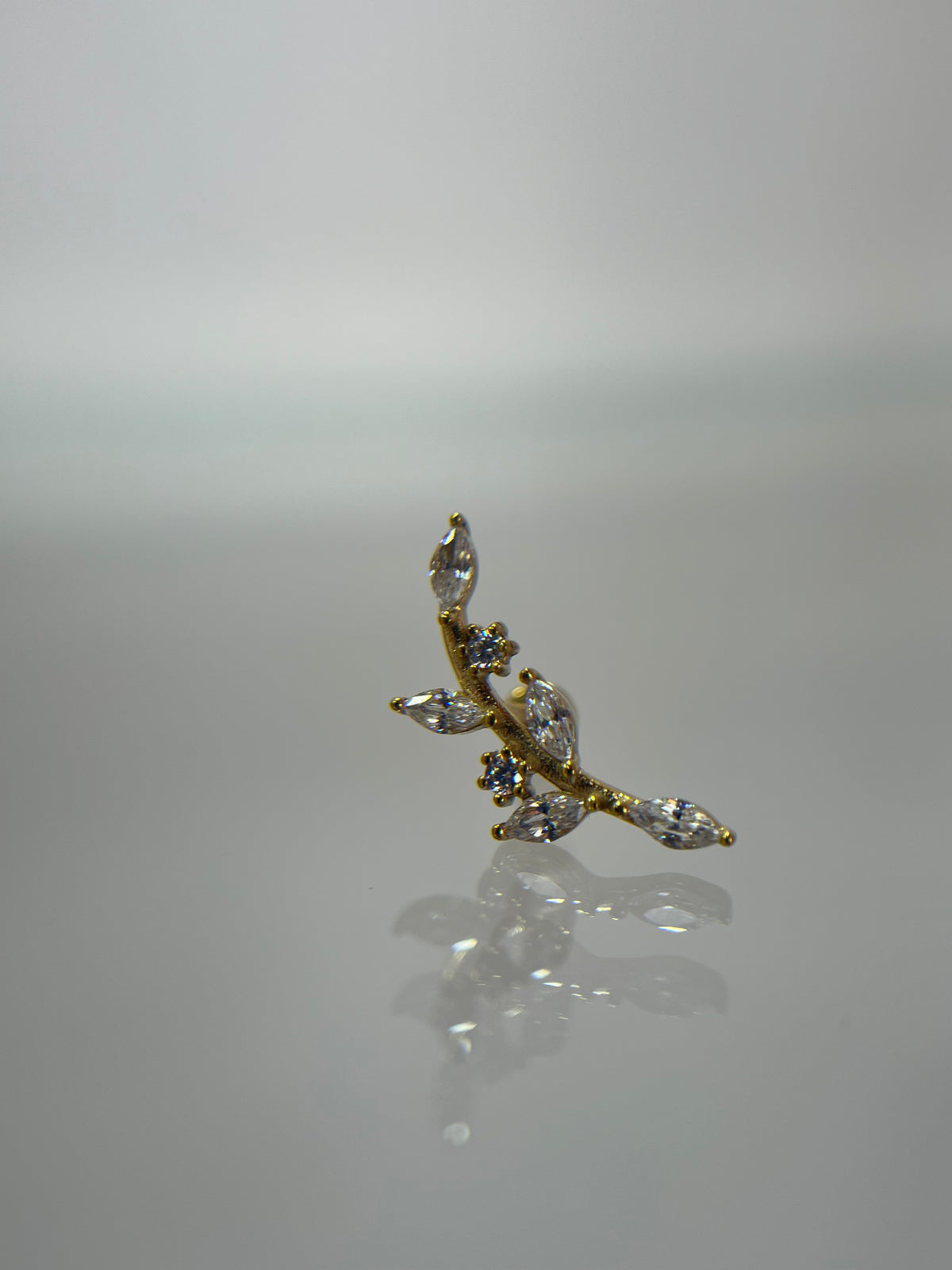 Piercing ramita titanium dorado (cierre plano)