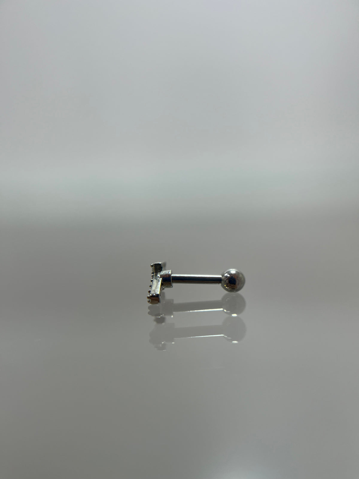 Piercing flecha acero plateado (cierre bolilla)