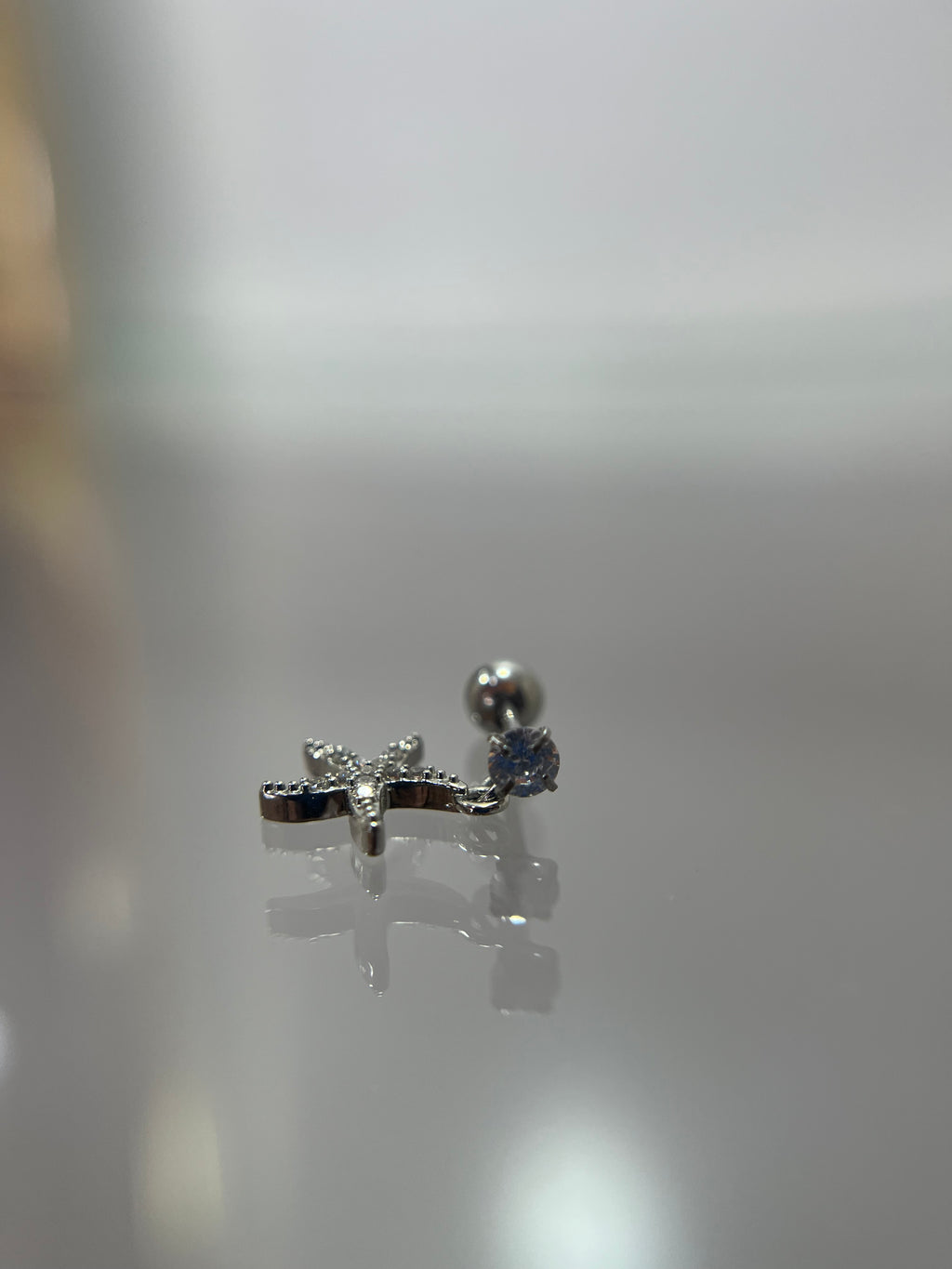 Piercings estrella de mar con diamante (cierre de esfera)