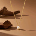 Collar con perla dorado