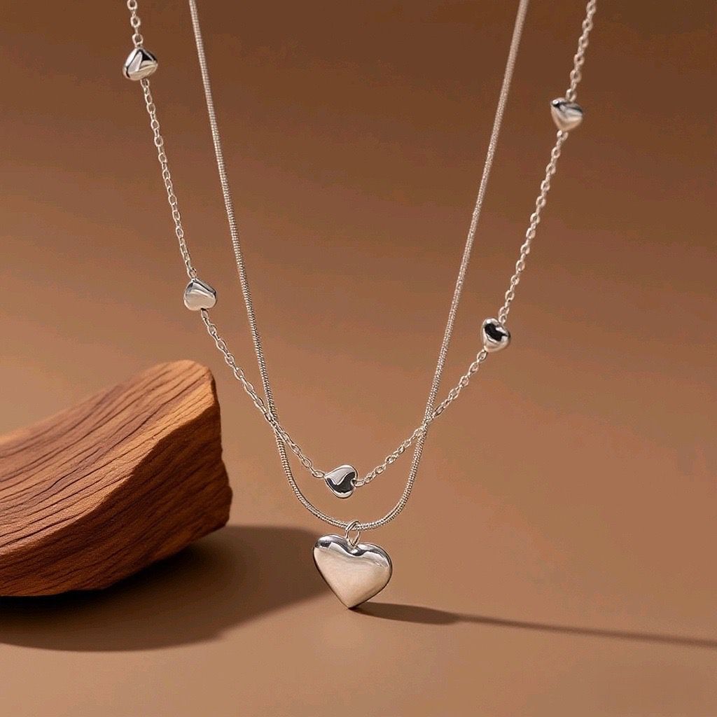 Collar doble de corazones plateado