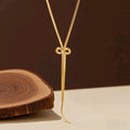 Collar largo de lazo dorado